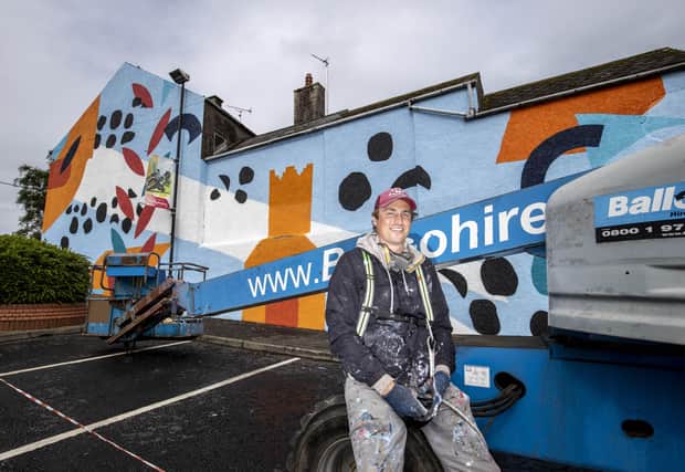 Artist Shane O’Driscoll works on his creation at Church Street Car Park in Ballymoney