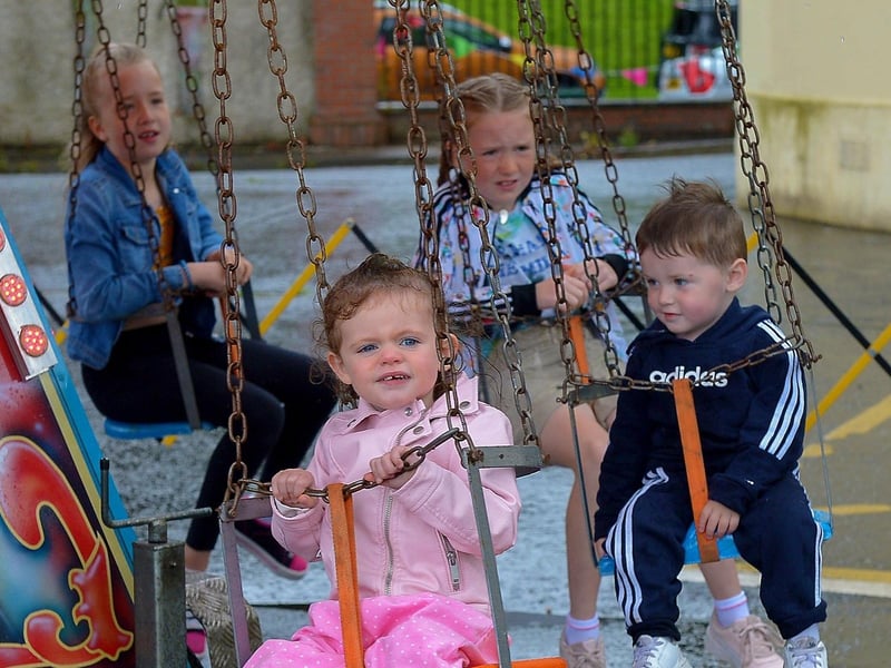 Children enjoy the fun of the Carousal ride at the Family Funday held in the Gasyard Centre on Sunday afternoon last. DER2132GS – 001