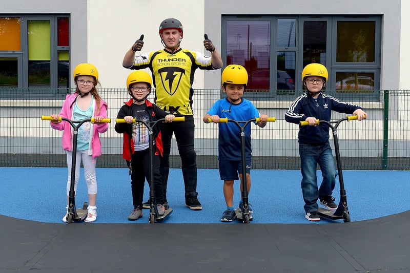Amelia-Rose McGuinness, Logan Hamill, Myles Jeerasoo and Lorcan Kearney pictured with BMX freestyle stunt performer Joel Harper at the Thunder Action Sports event at St Mary’s Youth Club on Sunday afternoon last. Photos: George Sweeney. DER2133GS – 006