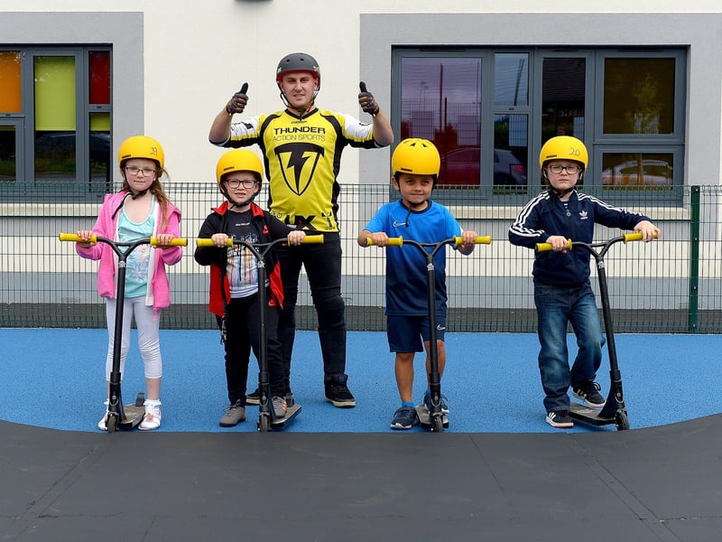 Amelia-Rose McGuinness, Logan Hamill, Myles Jeerasoo and Lorcan Kearney pictured with BMX freestyle stunt performer Joel Harper at the Thunder Action Sports event at St Mary’s Youth Club on Sunday afternoon last. Photos: George Sweeney. DER2133GS – 006