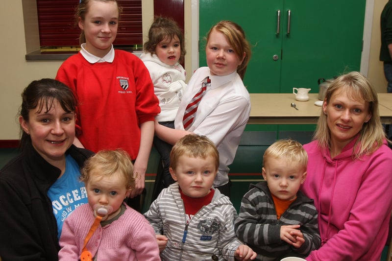 Parents and mothers attending the Drumahoe PS coffee morning organised in conjunction with Drumahoe Community Association, to raise funds for the Northern Ireland Childrens Hospice.  From left are Vivianne Striem, with Leona, Alana, Lara and Lauren Brace, and  Lynda Greenway with her two sons Karl and Dean.  INLS 4610-524MT