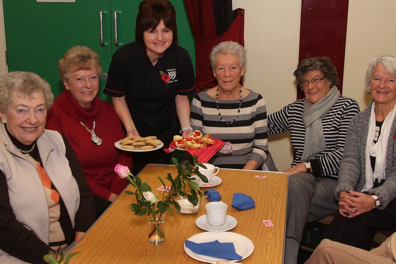 Adele Doherty, serving buns and scones to (from left), Sylvia  Dunseith,  Doris Grieve, Marion Garrigle, Betty Hegarty and Pearl Mowbray, at the Drumahoe PS coffee morning.  INLS 4610-527MT.