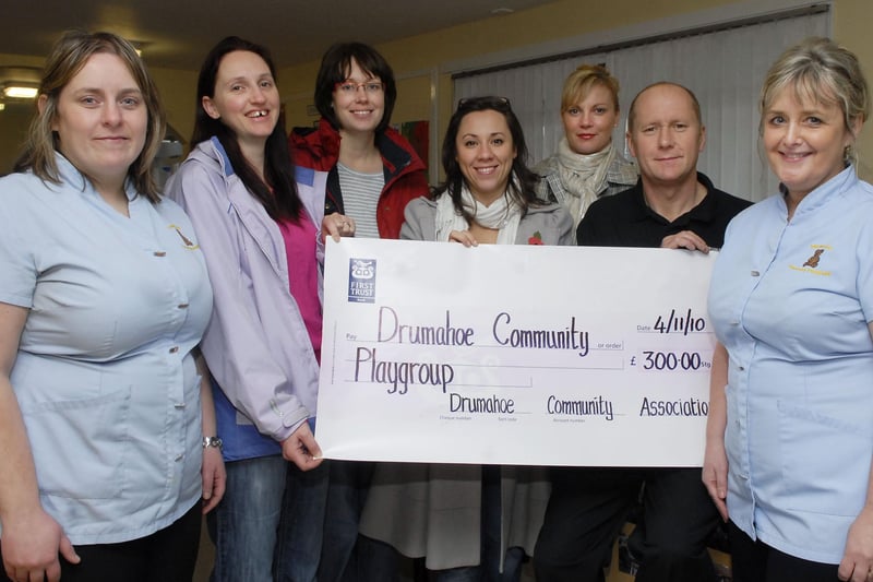 Robin Gardiner, of the Drumahoe Community Association, pictured handing over a cheque for £300.00, proceeds from a recent Tea Dance held in Drumahoe Primary School, to committee members of the Drumahoe Community Playgroup, from second left, Kitty Hepburn, Joanne Doherty, Kerry Credoz and Gillian Buchanan. Included are Nicola Adams, left, and Evelyn Catterson, acting playgroup leaders. INLS45-175KM10