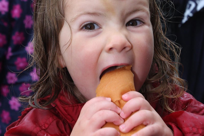 Esther Boggs, bites into a ‘giant’ hotdog, during her day at the Drumahoe Primary School ‘Fun Day’.  LS3810-544MT.