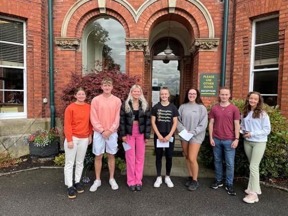 Friends Lisburn pupils smile having received their much-anticipated results