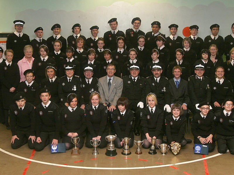 St. John Ambulance Brigade's Northern Cadets, who collected certificates and awards at their annual prize-giving, held at the Greenhaw Primary School. Included seated (third from left), are Linda Heaney, Divisional Superintendent, John McCready, Drill Officer, Martin O'Doherty, Divisional President, Ken Garrett, inspecting officer, Simon Wells, area staff officer, James Campbell, divisional leader, David Austin, assistant commissioner and Caroline Jamison, divisional leader. LS48-512MT.