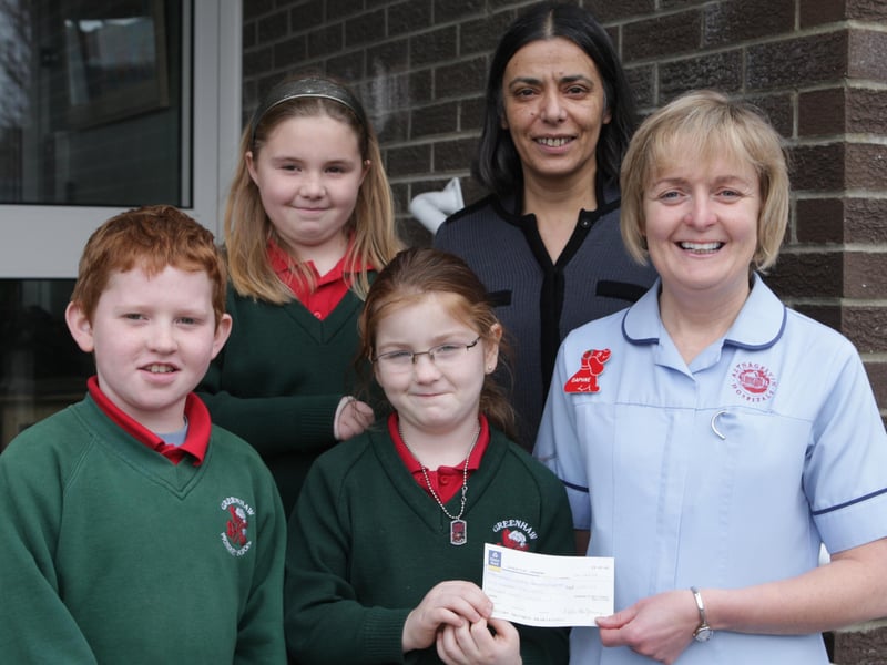 Greenhaw Primary School pupil Caoimhe Kelly, centre, who was recently diagnosed with diabetes, presenting £250, raised by the school through a non uniform day, to Daphne Patterson, Childrens Diabetes Specialist Nurse, Altnagelvin Hospital. Included are Rory McWilliams, Olivia Coyle and Mrs. Vindi Torney, principal. (2811C01)
