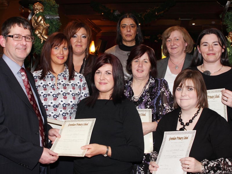 Brian keys of St Columb's College presenting certificates to parents who completed a Parental Support Porgramme in Numeracy at Greenhaw PS. Included is Greenhaw PS principal Vidi Tourney and paretns Edel Doherty, Ann DOnnelly, Anne McGeady, Siobhan McIntyre, Joanne Irvine, Brenda Killen with Eithne O'Doherty (Greenhaw PS). (2811JB26)