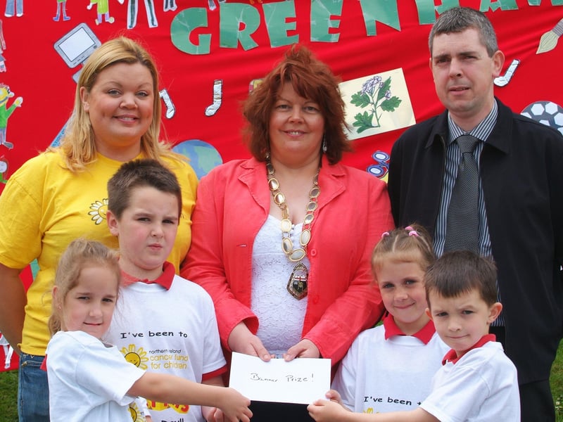 The Deputy Mayor, Councillor Patricia Logue, pictured presenting the prize for the best school banner to children from Greenhaw Primary School, at the annual schools sponsored walk and fun day held by the Northern Ireland Cancer Fund for Children in St. Columb's Park on Friday. Included are, Joanne Steele, corporate fundraiser, NI Cancer Fund for Children, and Michael McNicholl, store manager, Smyths Toys, Strand Road, sponsors of the event. LS22-121KM