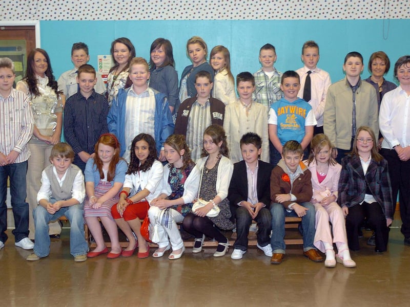 Pupils from Greenhaw Primary School who were confirmed on Monday by Most Rev. Francis Lagan at St Brigid's Church. Included are Ruth McKay, teacher, and Arlene Bowe, classroom assistant. (1604SL07)