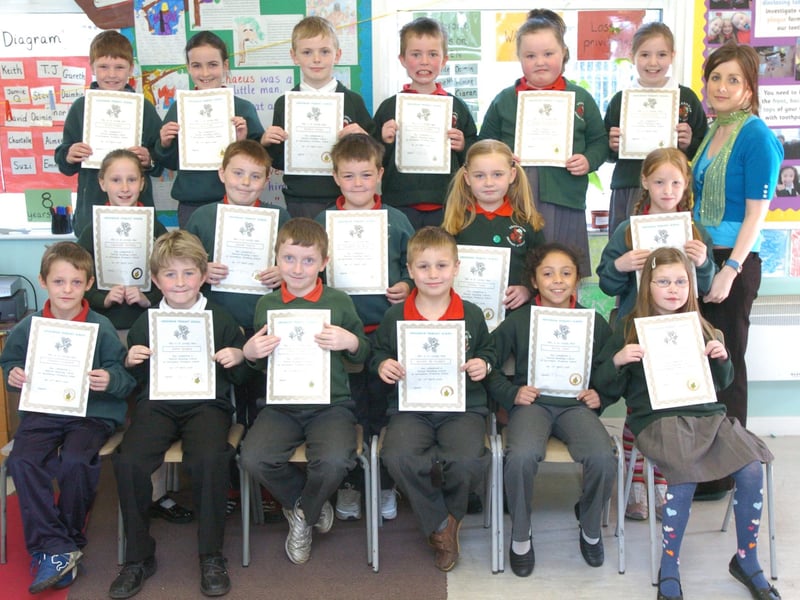 P4 pupils from Greenhaw Primary School receive certificates for completing a paired reading programme. Included is class teacher Ciara Mahon. (0505PG10)