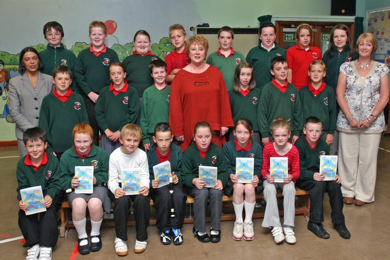 Year 6 pupils at Greenhaw PS launching their anthology entitled 'Learning to Fly', exploring the Myth and Legend of the world of the Imagination, pictured with their facilitator local storyteller Anita Robinson (centre), school principal Vindi Toney (left), and Ruth McKay, vice-principal. LS27-508MT.