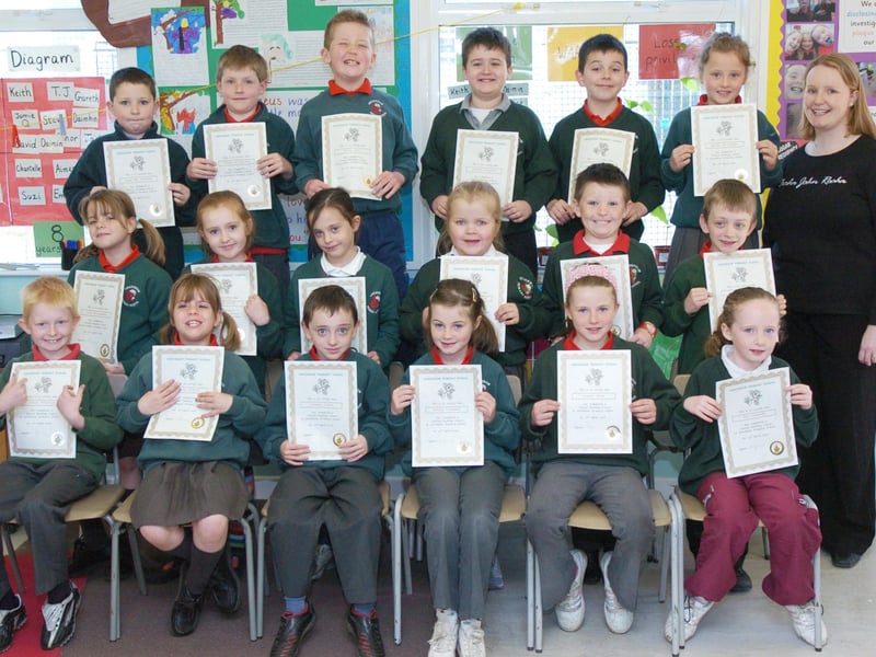 P4 pupils from Greenhaw Primary School receive certificates for completing a paired reading programme. Included is class teacher Sinead McFadden. (0505PG11)