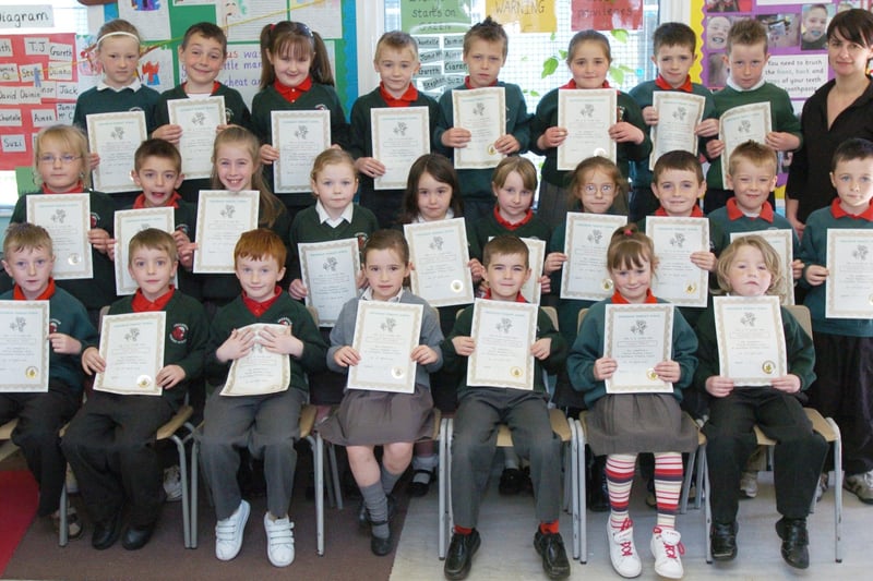 P3 pupils from Greenhaw Primary School receive certificates for completing a paired reading programme. Included is class teacher Cathy Gillespie. (0505PG12)