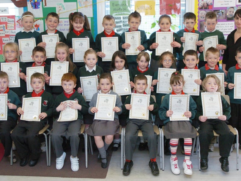 P3 pupils from Greenhaw Primary School receive certificates for completing a paired reading programme. Included is class teacher Cathy Gillespie. (0505PG12)