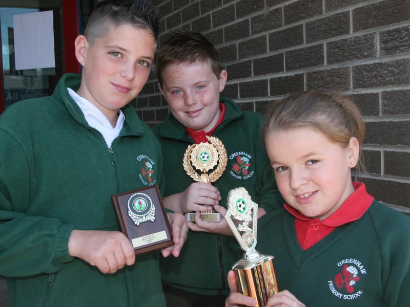 Greenhaw Primary School pupils who collected awards at the school's annual prize-giving. From left, Cain Breslin, Most Improved Footballer, David Harris, Male Penalty Kick cup and Emma McGlinchey, Female Penalty Kick cup. (2806T03).