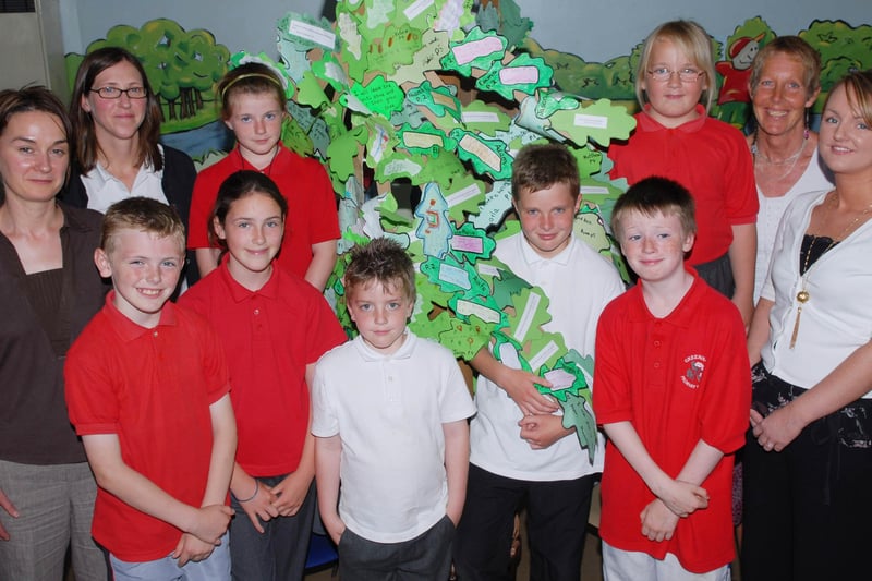 Susan Glass, second from left, bio-diversity officer, Derry City Council, pictured with members of the Greenhaw Primary School Eco Team, beside the tree which they have created using eco pledges for 2007-2008 from all the pupils at the school, the tree was put on display during the Breathing Places Festival in the Guildhall Square on Saturday. Included are, from left, Roberta Wilson, Daisy Mules, teachers, and Arlene Bowe, classroom assistant. LS24-142KM