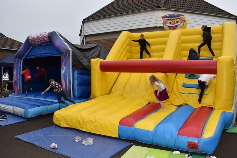 Having fun on the bouncy castles at the Spectrum Family Festival.