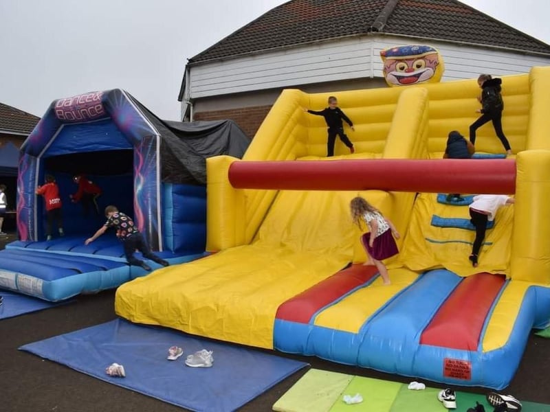 Having fun on the bouncy castles at the Spectrum Family Festival.