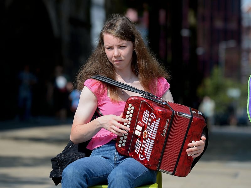 Irish traditional musician playing in Guildhall Square yesterday afternoon. Photo: George Sweeney. DER2134GS  023