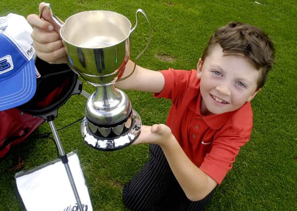 Possibly the youngest ever winner of Juvenile Captain's Day at Portadown Golf Club in 2010, Cameron Fox (8). PT35-251.