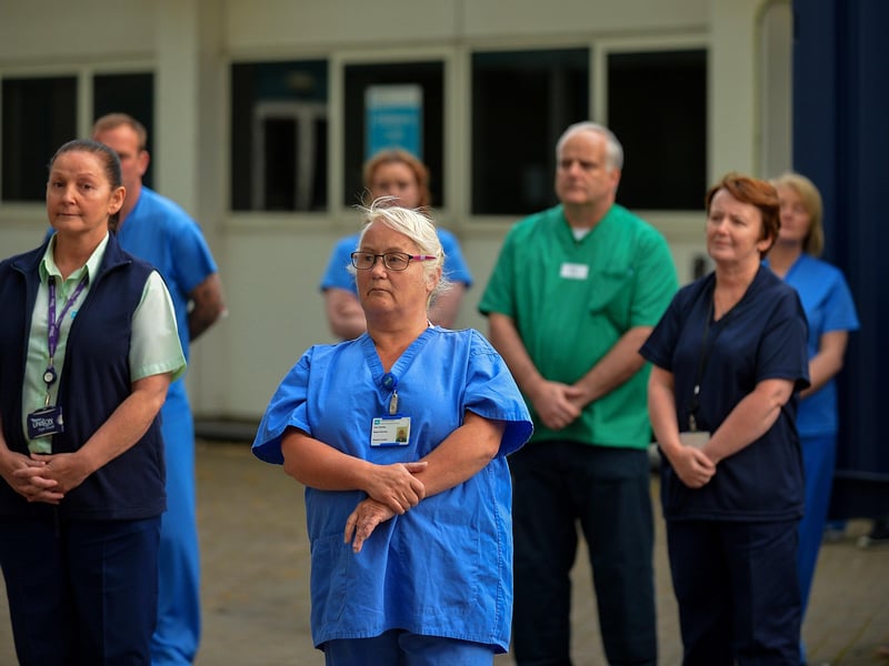 Care staff from Altnagelvin hospital, pictured on Thursday evening last, during an Act of Remembrance for all who have lost their battle with COVID-19. DER2020GS – 022