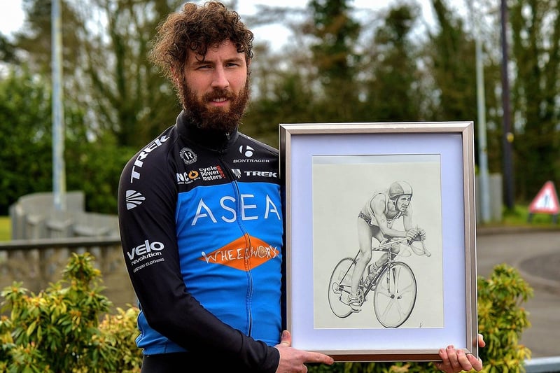 Danny Quigley, pictured earlier this year with a sketching of his triathlete father Colm. Photo: George Sweeney. DER2112GS - 001