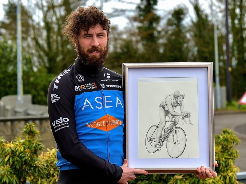 Danny Quigley, pictured earlier this year with a sketching of his triathlete father Colm. Photo: George Sweeney. DER2112GS - 001