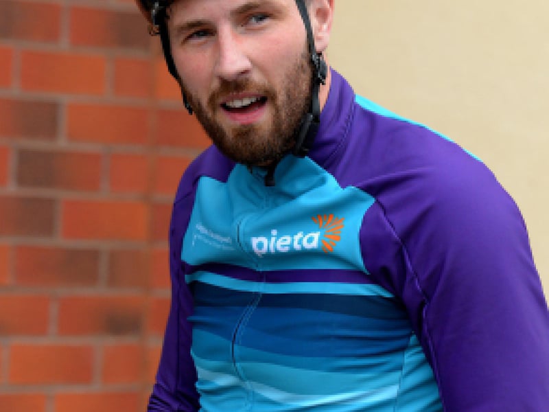 Epic triathlon hero Danny Quigley pictured at Destine’s premises, Foyle Road, on Sunday afternoon after completing his tenth and final daily 112 mile cycle before setting off on his final 26.2 miles run to complete 10 triathlons in 10 days for charity. Photo: George Sweeney / Derry Journal. DER2135GS – 004