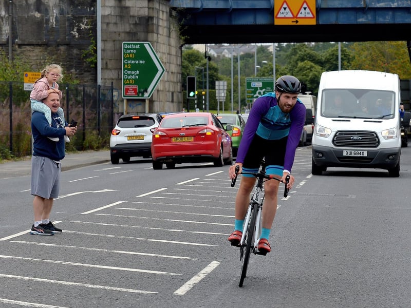 Ironman triathlon hero Danny Quigley is greeted by supporters and well-wishers as he arrives at Destine’s premises, Foyle Road, on Sunday afternoon after completing his tenth and final daily 112 mile cycle before setting off on his final 26.2 miles run to complete 10 triathlons in 10 days. Photo: George Sweeney / Derry Journal. DER2135GS – 001
