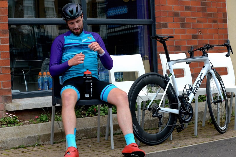 Epic triathlon hero Danny Quigley pictured at Destine’s premises, Foyle Road, on Sunday afternoon after completing his tenth and final daily 112 mile cycle before setting off on his final 26.2 miles run to complete 10 triathlons in 10 days for charity. Photo: George Sweeney / Derry Journal.  DER2135GS – 006