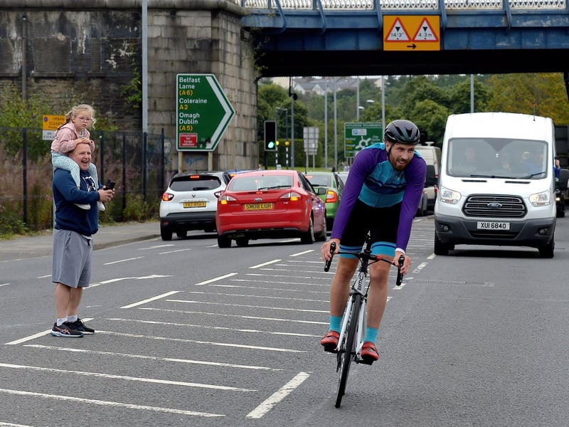 Ironman triathlon hero Danny Quigley is greeted by supporters and well-wishers as he arrives at Destine’s premises, Foyle Road, on Sunday afternoon after completing his tenth and final daily 112 mile cycle before setting off on his final 26.2 miles run to complete 10 triathlons in 10 days. Photo: George Sweeney / Derry Journal. DER2135GS – 001