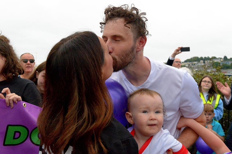 Sporting hero Danny Quigley receives a kiss from his partner Emear on his arrival at Destined after completing a gruelling 10 Ironman Triathlons in 10 days in memory of his dad and fundraising over £74,000 for charities.  Photo: George Sweeney / Derry Journal.  DER2135GS – 022