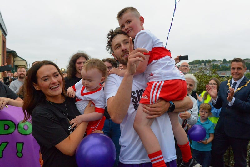 Sporting hero Danny Quigley is greeted by his partner Emear and sons Jack and Malachi on his arrival at Destined after completing a gruelling 10 Ironman Triathlons in 10 days in memory of his dad and fundraising over £74,000 for charities.  Photo: George Sweeney / Derry Journal.  DER2135GS – 023