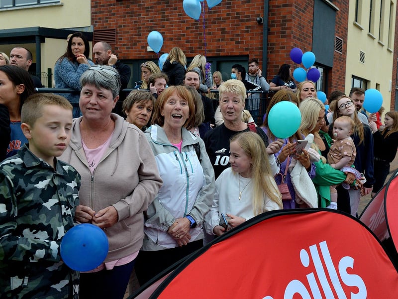 Friends and family cheer sporting hero Danny Quigley as nears the finish line after his epic 10 Ironman Triathlons in 10 days at Destined, Foyle Road on Sunday evening. Photo: George Sweeney / Derry Journal.  DER2135GS – 030