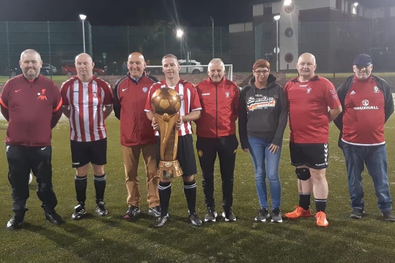 Some of the Tristar coaches pictured with the impressive Jon 'Ugg' Clifford Cup following the coaches versus past players match on Friday.