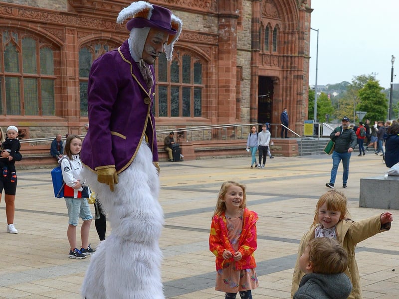 Children have fun with walkabout acts, in Guildhall Square, during the Carnival of Colours festival last weekend. Photo: George Sweeney / Derry Journal. DER2136GS – 036