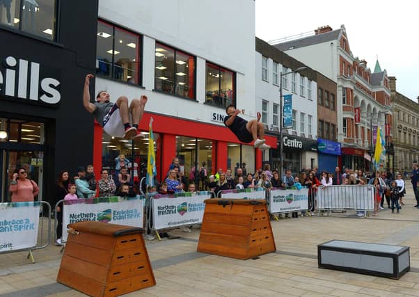 Jump NI’s Josh Agnew and George McGowan, perform in Waterloo Place during the Carnival of Colours festival, last weekend. Photo: George Sweeney / Derry Journal. DER2136GS – 040