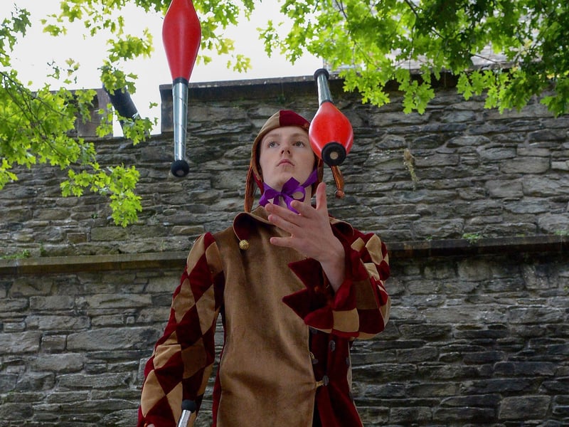 Jeremy the Juggling Jester performs in Guildhall Square during the Carnival of Colours festival last weekend. Photo: George Sweeney / Derry Journal. DER2136GS – 015