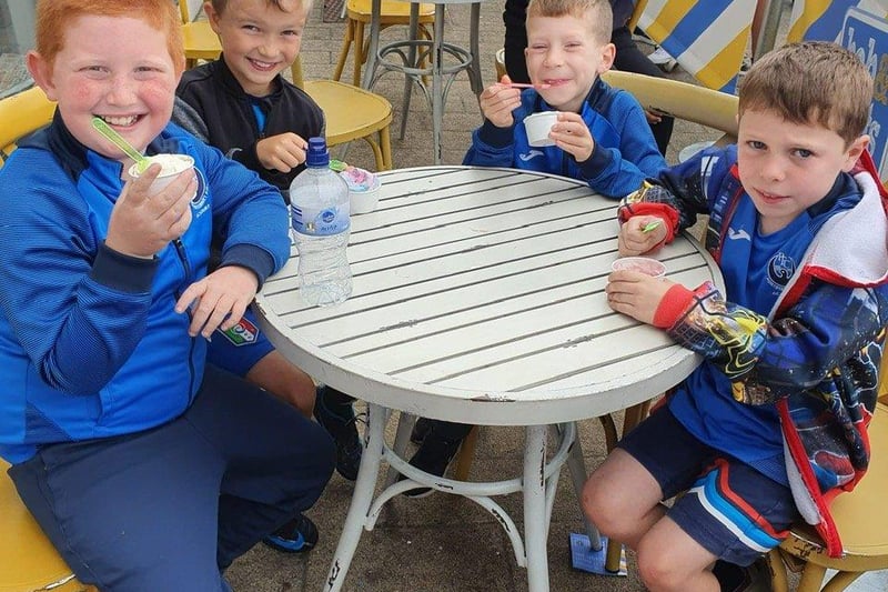 Pictured outside Bob & Berts, enjoying their free ice-cream