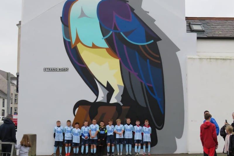 Pictured at the Diamond in Portstewart with the seahawk mural are some of the older seahawks after their sponsored walk