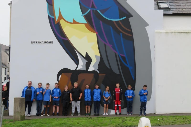 Members of the Portstewart FC Academy pictured at the Diamond in front of the seahawk mural by artist Dan Leo