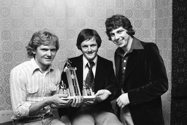 From left, Aidan O’Connell, captain Coshquin F.C., being presented with the winning trophy of a summer football competition organised by Grianan Celtic F.C. by secretary, Stephen Gillespie, centre, and, on right, Denis Whoriskey, Grianan Celtic F.C. team manager.