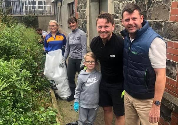 Principal Robert Dinsmore (right) with parents and pupils who took part in the community gardening event