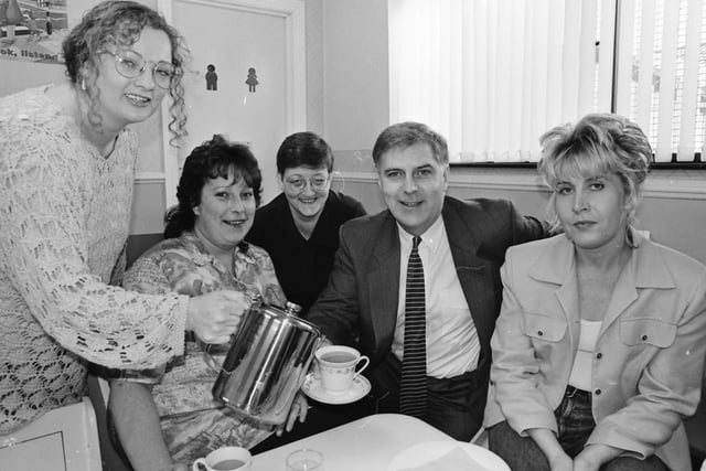 Paula McKay pours a cuppa for Robin Mullan, NI director, National Lotteries Charities Board, after he officially opened the Ballymagraorty Mothers and Toddlers’ Centre. Included, from left, are Lorna Murray, Shirley Deane, chairperson, and, on right, Oonagh Cusack.