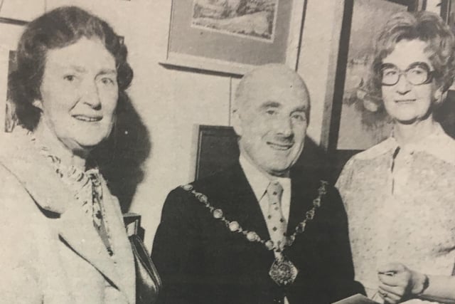 Mayor and Mayoress of Lisburn with Mrs Jean Morrison at an art exhibition in the Shambles in Hillsborough in 1980