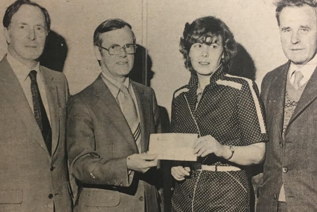 Mr John McDowell, principal of Lisburn Technical College, presented a cheque for £730 to Sister Anne Tinsley of the Royal VIctoria Hospital Cardiac Unit in 1980. Also included are Mr W Cowan, vice principal, and Mr RH Davidson, senior lecturer