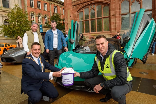Organisers Gary McCaul and Keith Gamble with the Mayor Alderman Graham Warke and Christopher Cooper during Super Car Sunday in aid of the Mayorâ€TMs Charity Appeal for Foyle Down Syndrome Trust. Picture Martin McKeown. 03.10.21