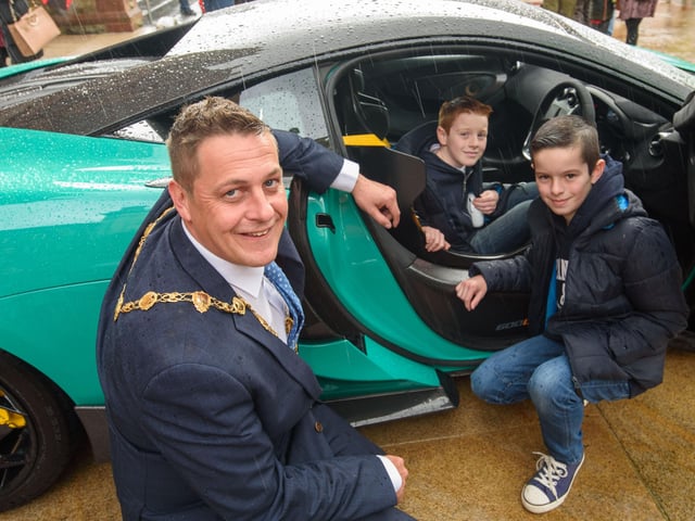 The Mayor, Aderman Graham Warke with Evan and Keenan Gallagher during Super Car Sunday in aid of the Mayorâ€TMs Charity Appeal for Foyle Down Syndrome Trust. Picture Martin McKeown. 03.10.21