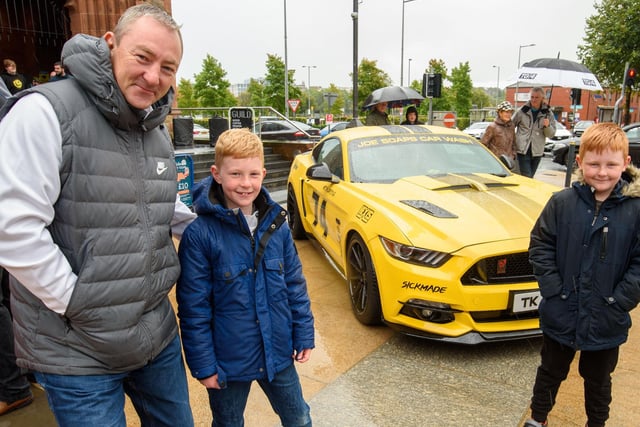 Keith Baldrick and his sons Will and Alfie with a Ford Mustang during Super Car Sunday in aid of the Mayorâ€TMs Charity Appeal for Foyle Down Syndrome Trust. Picture Martin McKeown. 03.10.21